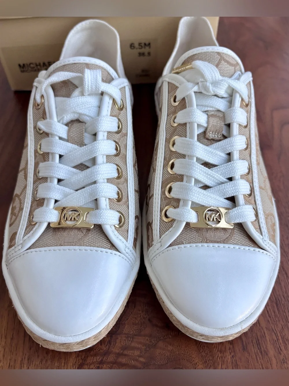 Brand New pair of Michael Kors Kristy Slide Sneakers in a cream and beige, 6.5.
